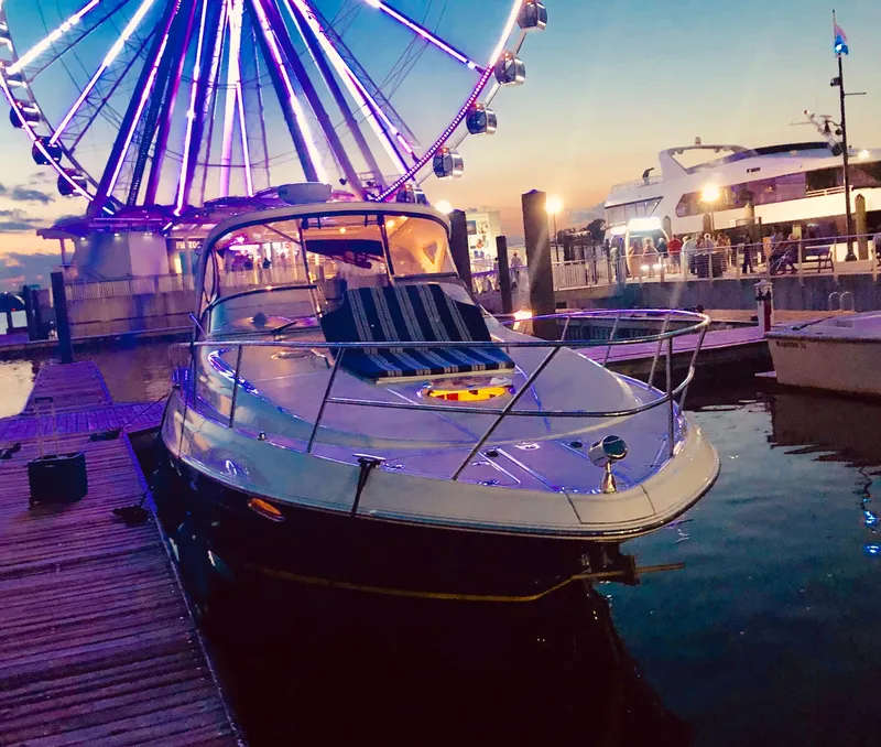 Slide: The Image of Regal Commodore 3760 IO 2009 by illuminated Ferris wheel at dock. - 32
