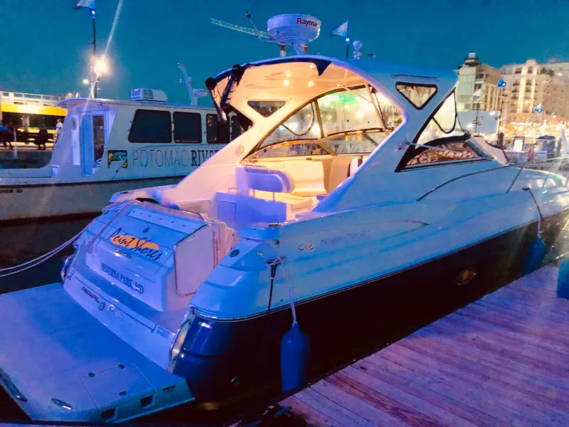 Slide: The Image of 2009 Regal Commodore 3760 IO yacht docked at night. - 33