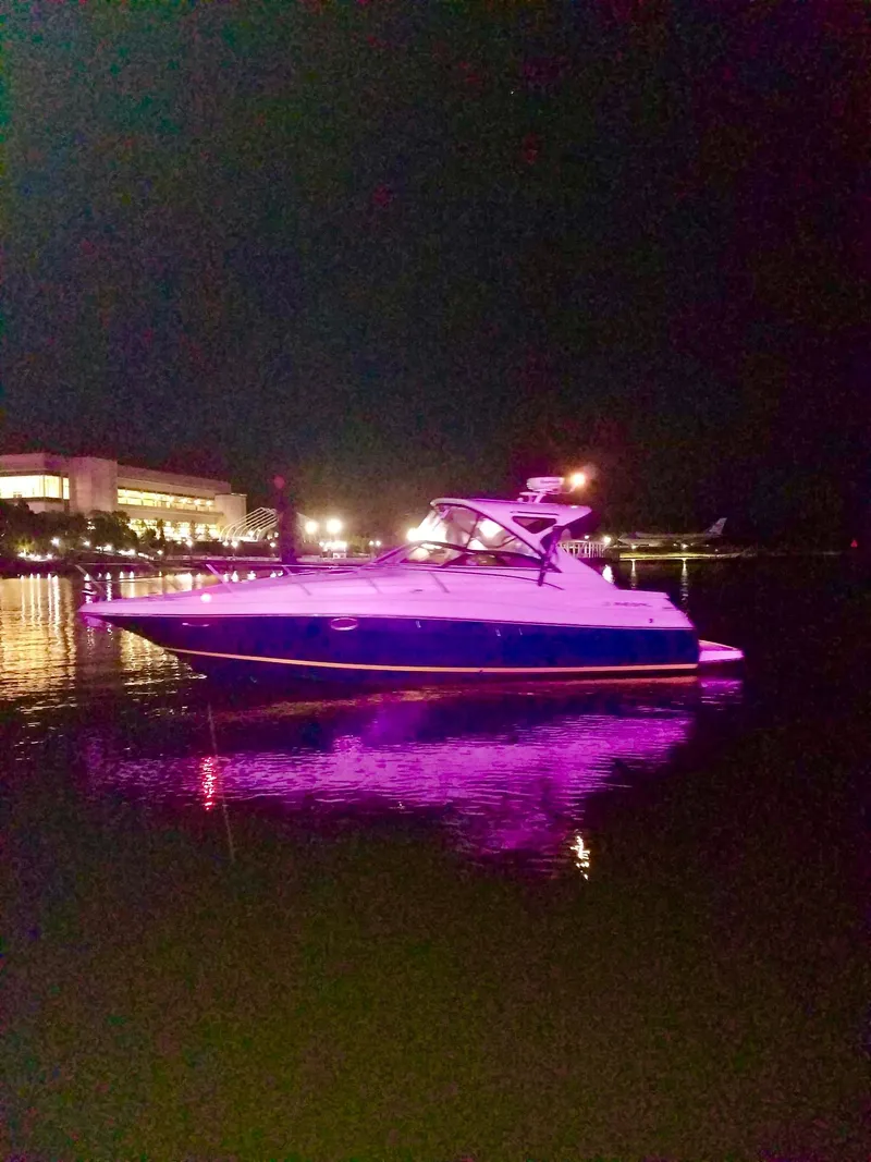 Slide: The Image of 2009 Regal Commodore 3760 IO at night with purple lighting. - 4