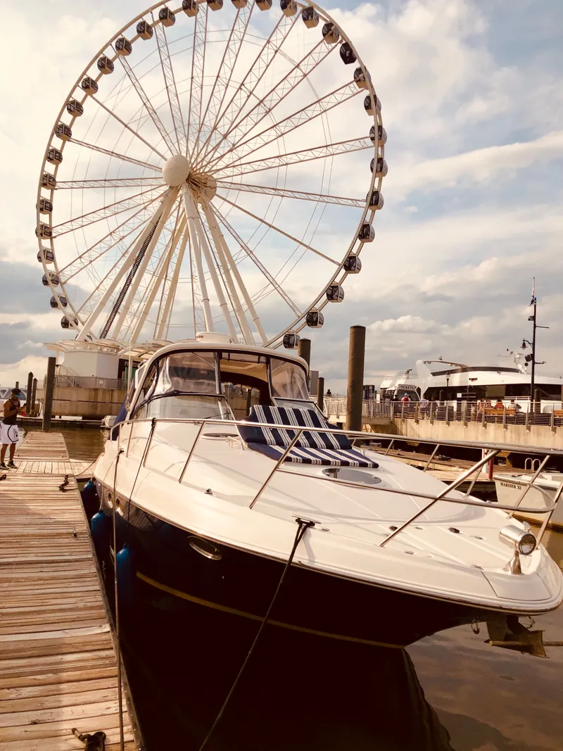 Slide: The Image of 2009 Regal Commodore 3760 IO near Ferris wheel at dock. - 42