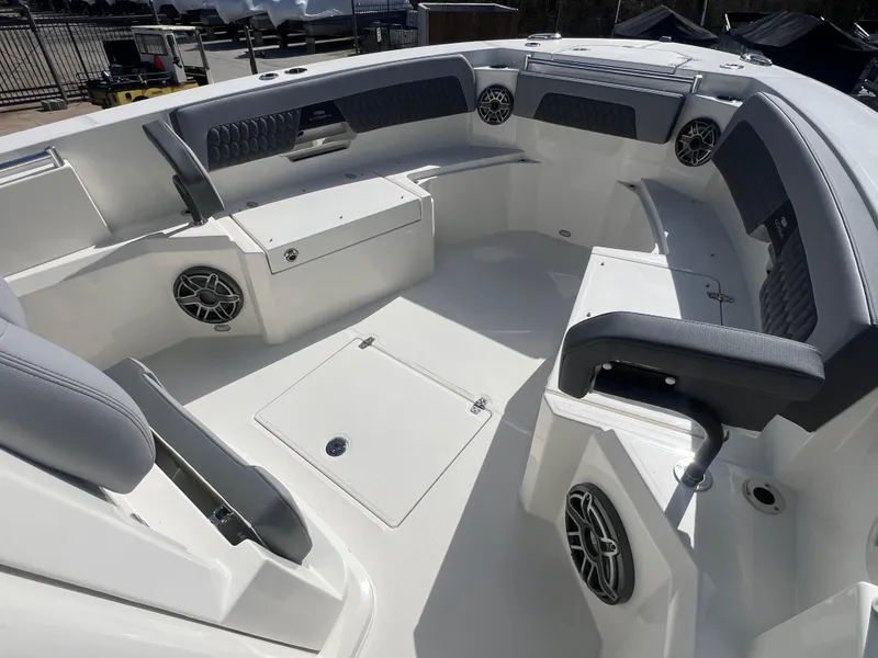 Slide: The Image of 2025 Cobia 285 Open Center Console boat interior with spacious seating and modern design. - 14