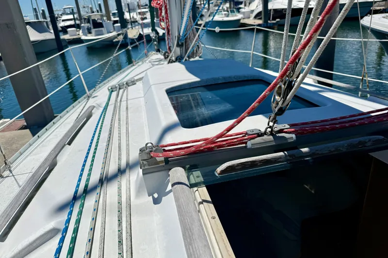 Slide: The Image of Beneteau Oceanis Clipper 311 sailboat deck, 2002 model, docked at marina. - 12