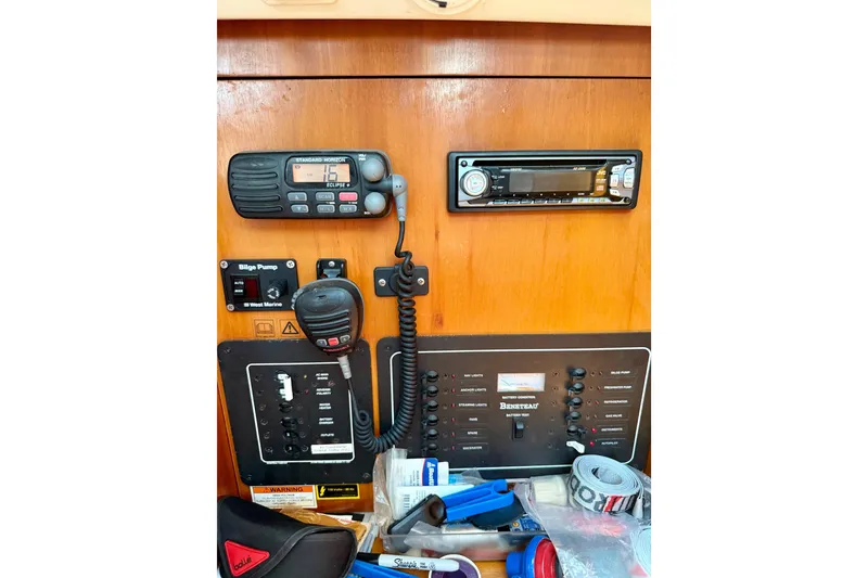 Slide: The Image of Control panel of a 2002 Beneteau Oceanis Clipper 311 sailboat with radio and equipment. - 13
