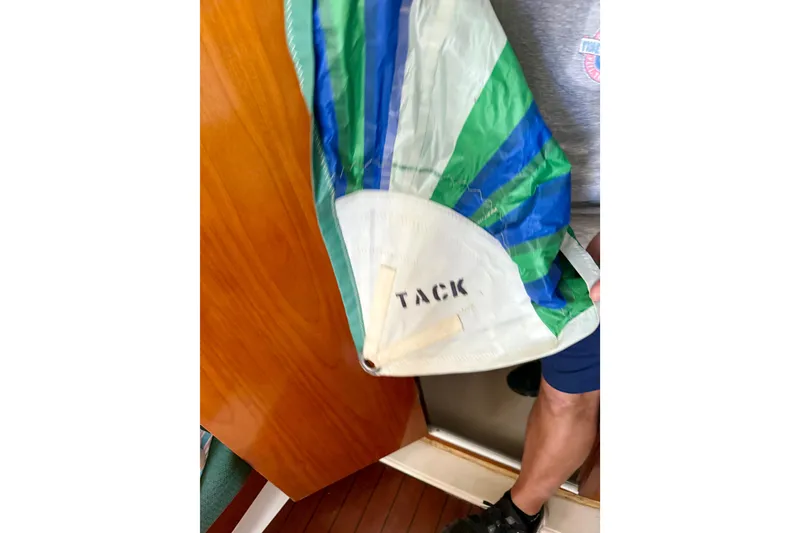 Slide: The Image of Colorful sail labeled "TACK" on a 2002 Beneteau Oceanis Clipper 311 yacht. - 18