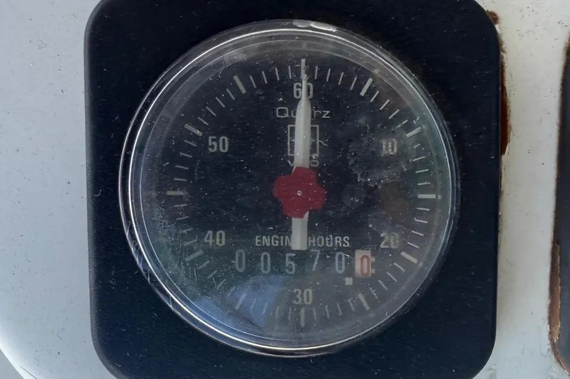 Slide: The Image of Engine hour meter showing 5700 hours on a 2002 Beneteau Oceanis Clipper 311. - 23