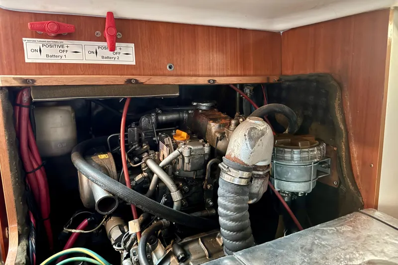 Slide: The Image of Engine compartment of a 2002 Beneteau Oceanis Clipper 311 sailboat, showing battery switches. - 27
