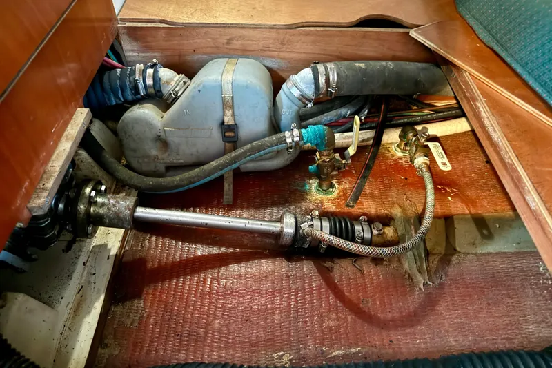 Slide: The Image of Engine compartment of a 2002 Beneteau Oceanis Clipper 311 sailboat, showing mechanical components. - 29
