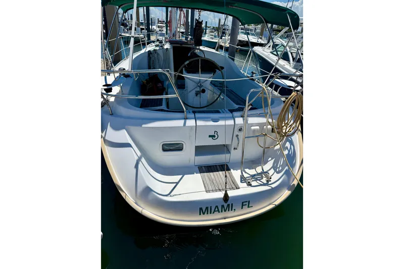Slide: The Image of Beneteau Oceanis Clipper 311 sailboat docked in Miami, FL, 2002 model. - 3