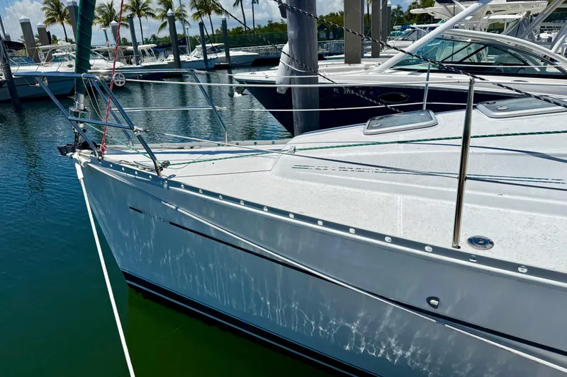 Slide: The Image of 2002 Beneteau Oceanis Clipper 311 sailboat docked in a marina. - 4