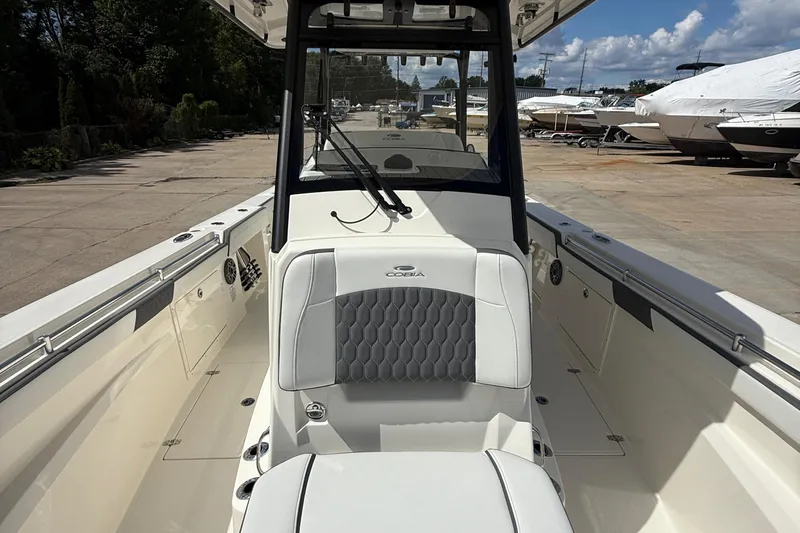 Slide: The Image of 2026 Cobia 305 Center Console boat interior with sleek seating and modern design. - 24