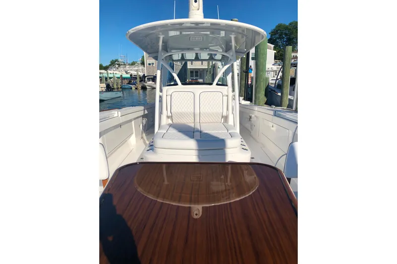 Slide: The Image of 2025 Valhalla Boatworks V-41, sleek design, docked at marina under clear blue sky. - 15
