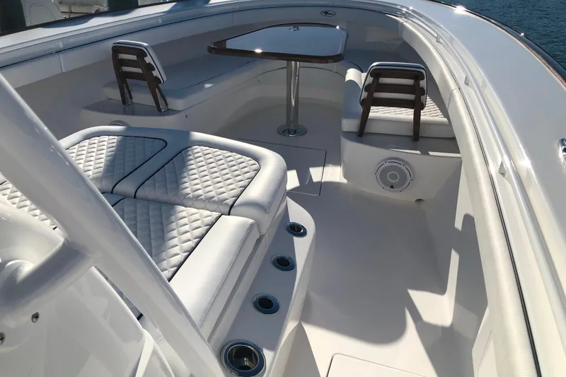 Slide: The Image of 2025 Valhalla Boatworks V-41 interior with luxurious seating and table setup. - 16