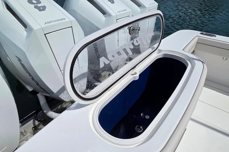 Slide: The Image of 2025 Valhalla V-41 boat with open storage compartment and Mercury engines. - 21