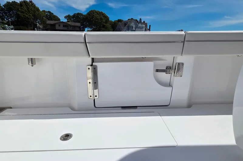 Slide: The Image of 2025 Valhalla Boatworks V-41 interior detail with sleek white finish and secure latch. - 22