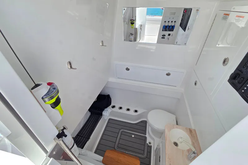 Slide: The Image of 2025 Valhalla Boatworks V-41 interior cabin with modern amenities and sleek design. - 25