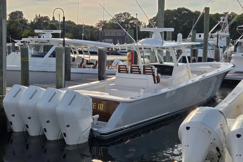Slide: The Image of 2025 Valhalla Boatworks V-41 docked, featuring four powerful outboard engines. - 4