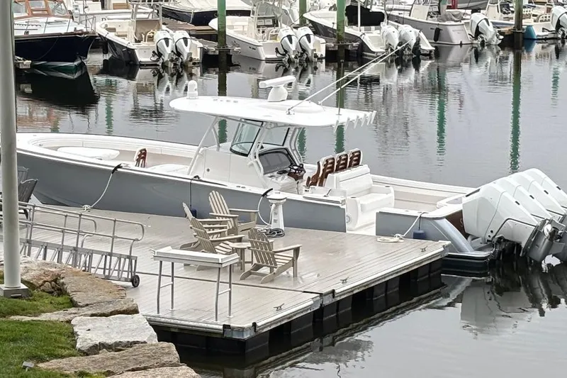 Slide: The Image of 2025 Valhalla Boatworks V-41 docked at marina with multiple outboard engines. - 5