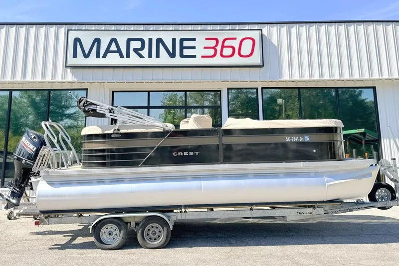 The Image of 2021 Crest Classic DLX 220 SLC pontoon boat on trailer at Marine 360 dealership. - 1