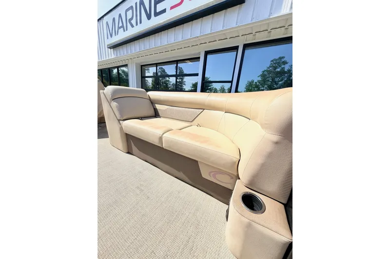 Slide: The Image of 2021 Crest Classic DLX 220 SLC boat seating, beige upholstery, outside Marine showroom. - 5