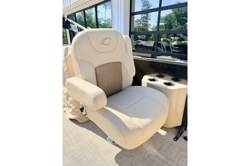 Slide: The Image of 2021 Crest Classic DLX 220 SLC boat seat with cup holders, beige upholstery. - 8
