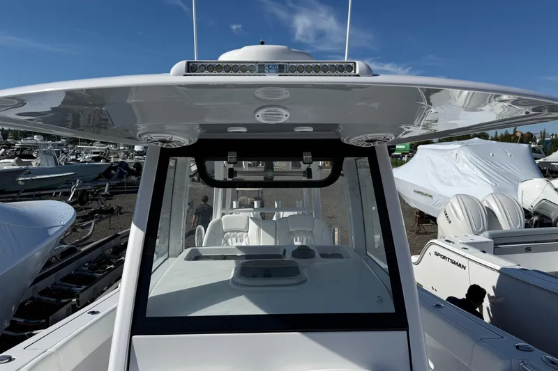 Slide: The Image of 2026 Sportsman Open 302 Center Console boat with sleek design and advanced features. - 8