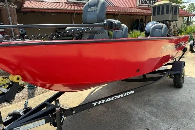 The Image of 2026 Tracker Pro Guide V-16 SC boat in vibrant red on a trailer. - 0