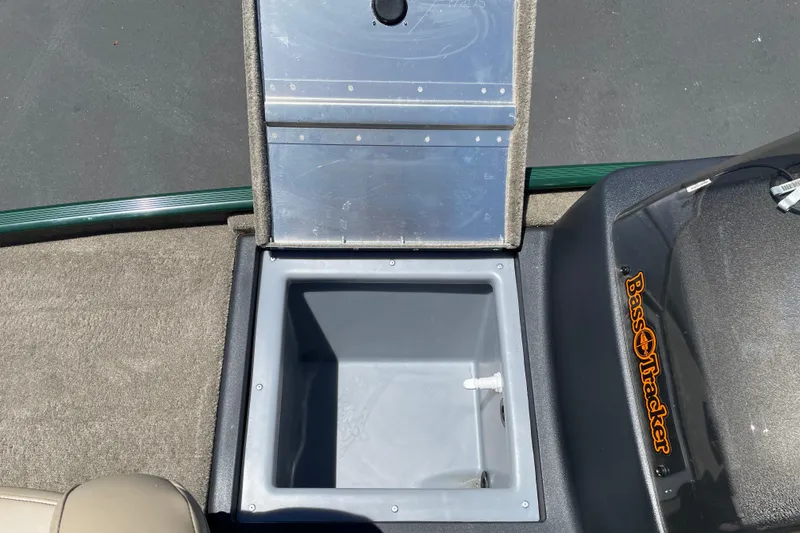 Slide: The Image of Open storage compartment in 2026 Tracker Bass Tracker Classic Limited boat. - 7