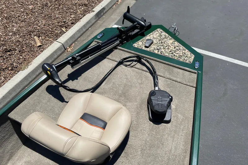 Slide: The Image of 2026 Tracker Bass Tracker Classic Limited boat interior with seat and trolling motor. - 8