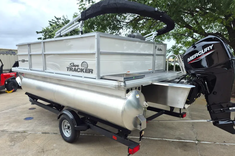 Slide: The Image of 2026 Sun Tracker Party Barge 16 DLX pontoon boat with Mercury engine on trailer. - 7
