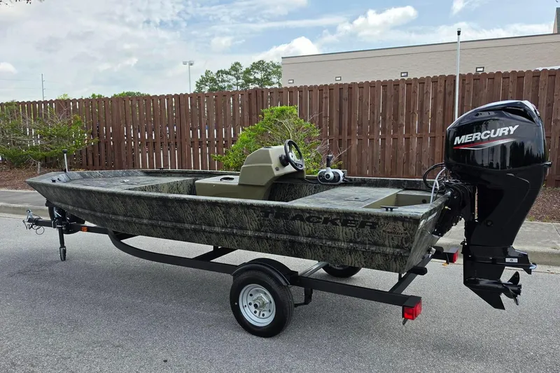 Slide: The Image of 2026 Tracker Grizzly 1648 SC boat with Mercury engine on trailer. - 9