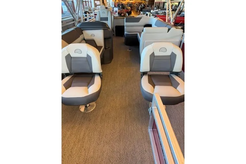 Slide: The Image of Interior of 2026 Sun Tracker Fishin' Barge 22 DLX with comfortable seating. - 4
