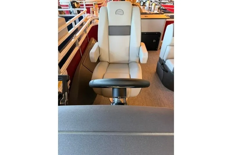 Slide: The Image of 2026 Sun Tracker Fishin' Barge 22 DLX captain's chair and steering wheel. - 14