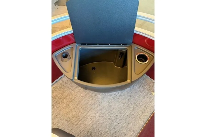 Slide: The Image of Open storage compartment on 2026 Sun Tracker Fishin' Barge 22 DLX boat. - 11