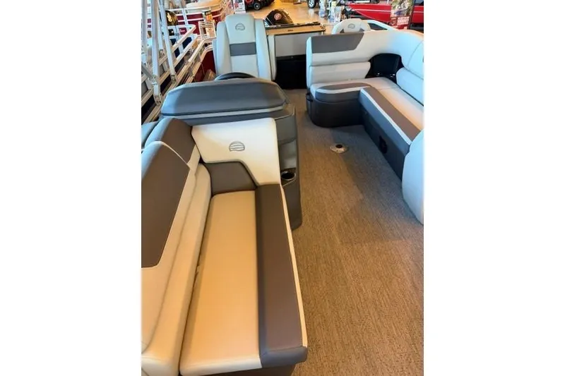 Slide: The Image of 2026 Sun Tracker Fishin' Barge 22 DLX interior with spacious seating and modern design. - 8