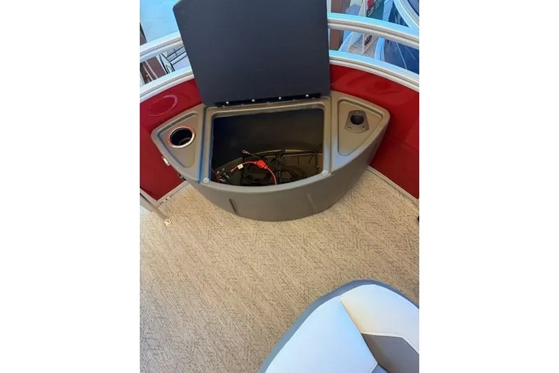 Slide: The Image of Storage compartment on 2026 Sun Tracker Fishin' Barge 22 DLX pontoon boat interior. - 10