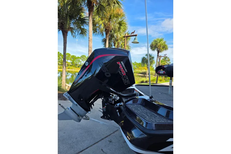 Slide: The Image of Boat with Mercury Pro XS engine, Nitro Z20 XL 2026 model, parked near palm trees. - 5
