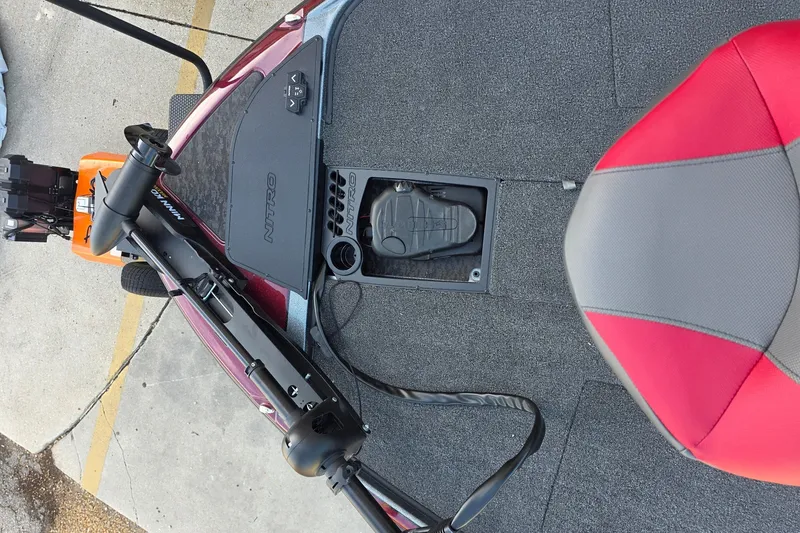 Slide: The Image of 2026 Nitro Z20 XL boat deck with trolling motor and red-gray seat. - 4