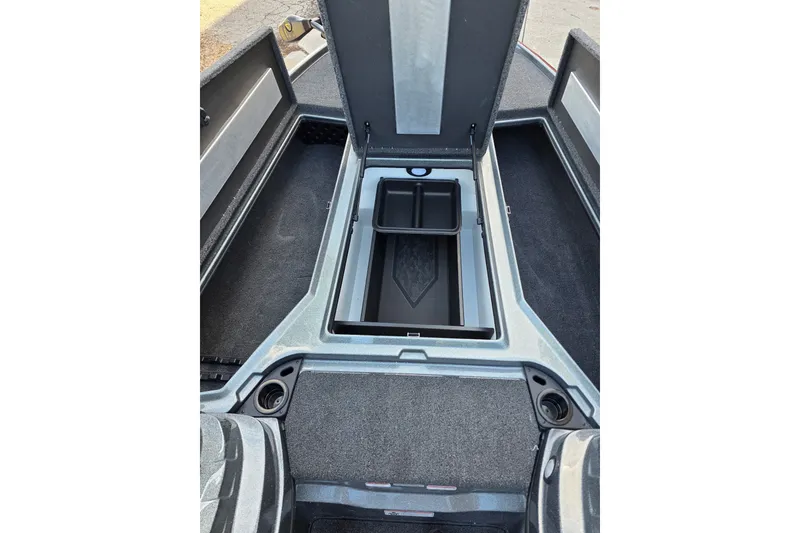 Slide: The Image of 2026 Nitro Z20 XL boat storage compartment with open lid and organized interior. - 10