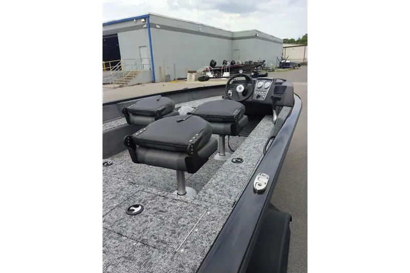 Slide: The Image of 2026 Tracker Pro Guide V-16 SC boat interior with seating and control panel. - 5