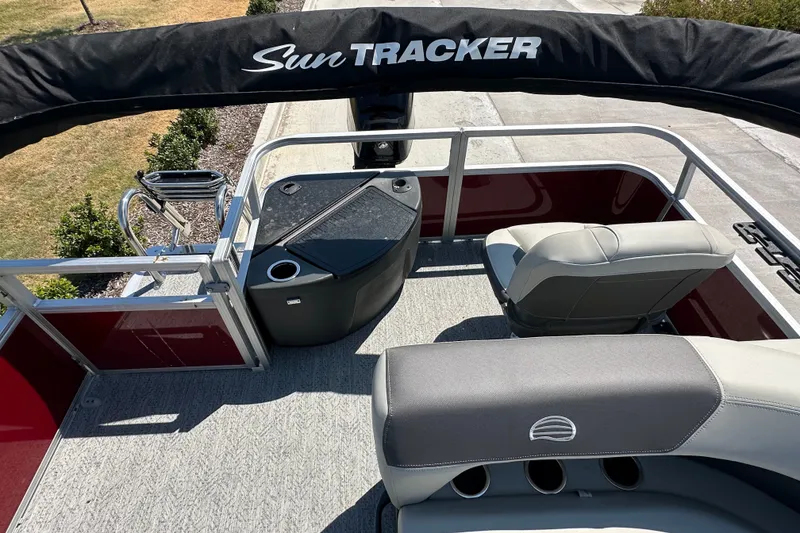 Slide: The Image of 2026 Sun Tracker Bass Buggy 18 DLX pontoon boat interior with seating and storage. - 31