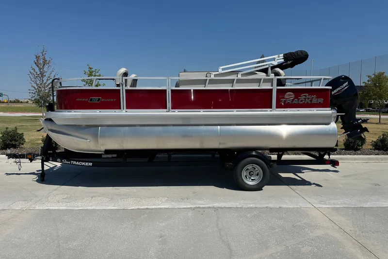 The Image of 2026 Sun Tracker Bass Buggy 18 DLX pontoon boat on trailer, side view. - 15