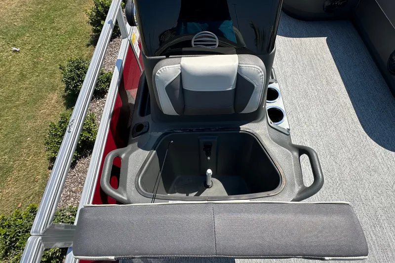 Slide: The Image of 2026 Sun Tracker Bass Buggy 18 DLX boat interior with seating and storage compartment. - 30