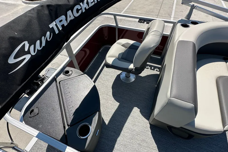 Slide: The Image of 2026 Sun Tracker Bass Buggy 18 DLX interior with seating and storage compartments. - 32