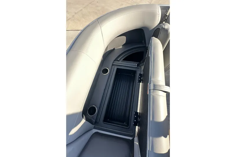Slide: The Image of 2026 Sun Tracker Party Barge 16 DLX seating with storage compartment and cup holders. - 24