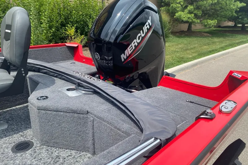 Slide: The Image of 2026 Tracker Pro Guide V-16 WT boat with Mercury engine, red and gray interior. - 4