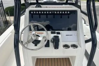 Slide: The Image of 2026 Ranger 2360 Bay boat console with steering wheel and controls. - 3