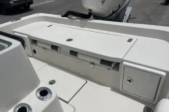 Slide: The Image of 2026 Ranger 2360 Bay boat deck with storage compartments and cup holders. - 6