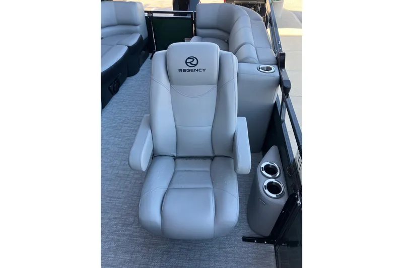 Slide: The Image of Luxurious seating on 2026 Regency 230 DL boat with cup holders and elegant design. - 8