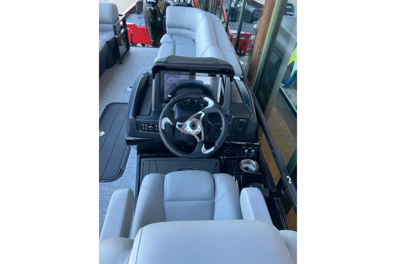 Slide: The Image of Luxurious interior of 2026 Regency 230 DL boat with modern steering console. - 10