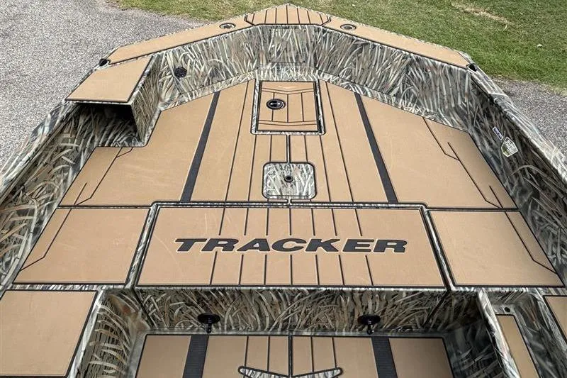 Slide: The Image of 2026 Tracker Grizzly 1756 T Marsh boat with camo design and spacious deck. - 6